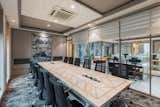 The third floor includes the director’s cabin and private meeting rooms. All these spaces follow a colour palette that combines grey and blue tones. The workplace focuses on tasks relating to water, thus it makes sense that these colours represent water. The colour scheme is meant to convey professionalism, serenity, and a link to the water motif. Further, the fourth and fifth floors are designated for private bedroom spaces along with a penthouse for party areas. These cater to the various needs of the occupants. 

