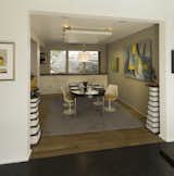 Dining room with 2 of Jeffs concrete & wood pedestals, Saarinen tulip chairs