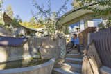 Susan with lotus basin & concrete stairway with salvage metal elements