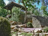 Japanese timber frame building with backyard boulders