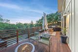 Elevated patio deck perched at the tree-line to maximize view and privacy 