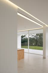 Kitchen, Porcelain Tile Floor, and White Cabinet  Photo 2 of 20 in Warm White by WOW estudio