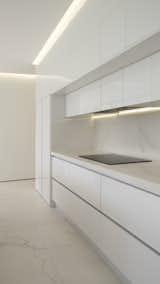 Kitchen, White Cabinet, and Porcelain Tile Floor  Photo 16 of 20 in Warm White by WOW estudio