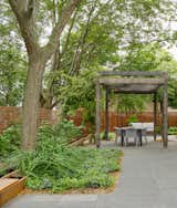 The garden is softly landscaped with granite pavers 