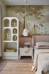 A youthful bedroom space enriched with artistic details and a palette inspired by nature’s subtle hues.