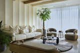 A living room where every detail, from the wood beams to the soothing color palette, invites relaxation and conversation.