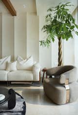Modern contours meet natural textures in a living space designed to have the best conversation over evening coffee.