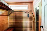 A cedar sauna sits off the library.