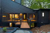The house is clad in custom-milled cedar siding.