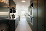 The renovated kitchen features Carrara marble countertops.