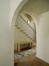 The couple swapped the home’s wooden railing for a custom one made of wrought iron.