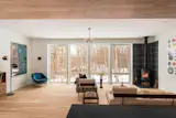 A Norwegian-style Morsø wood stove anchors the living room.