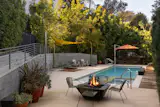 The property includes a private bocce court, swimmers pool, and jacuzzi.