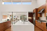 The kitchen cabinetry is made from book-matched walnut wood.