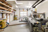 The garage is 500-square-foot heated garage is adaptable to a variety of uses, currently set up as a workshop.