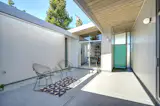 Like many of Eichler's designs, the home includes an open-air courtyard. In this home's layout, the street entry leads directly to the atrium.