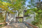 Architect James Oliver’s quirky ’70s home has spiral staircases, suspended fireplaces, a catwalk, and an office perched in the forest canopy.
