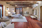 The primary suites open to secluded courtyards.