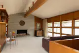 A the interior finishes are a mixture of concrete block and wood paneling.
