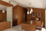 The interior finishes are a mixture of concrete block and wood paneling.
