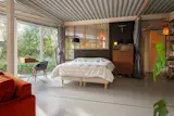 The modular corner, able to be separated by a curtain rail, currently serves as an additional bedroom.