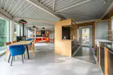 An electric woodstove helps the heat the main room.