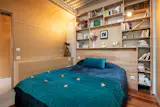 The bedroom features built-in storage.