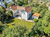 Topped With a Colorful Shingled Roof, an Ornate French Villa Seeks $2.5M