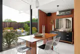 Vinyl-tiled floors and wood paneling maintain the home's '60s design ethos.