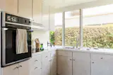 The kitchens include original cabinetry.
