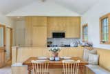 Dining banquette and kitchen beyond