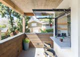 A servery window connects the JADU kitchenette and its deck