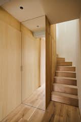The second-floor entrance features a staircase leading to the third floor