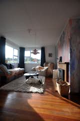 Sun-filled by day, with the addition of the cozy fireplace, the dog is not the only one who likes to laze around in here...
