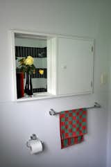 Much of the bathroom is original but again, we couldn't resist adding some tiles around the bath / shower. The house is small, so elements like the tiles match between kitchen & bathroom, we have the same curtin fabric throughout & there are numerous other repetitions to encourage flow & overall cohesion. 