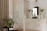 The entry way was closed off with custom millwork and block off the entry into the bedroom area.