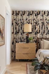 Bold prints are a favorite and work well as a wall to wall drapery moment helps to hide the offset windows. 