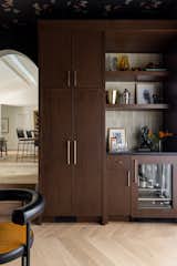 The auxiliary room acts as a great place to make cocktails and hosts guests. What used to be the old single car garage is now an opulent space to entertain and has double doors into the back yard.