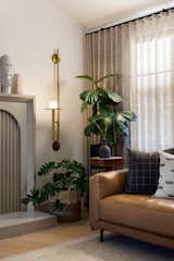 What was a brick clad fireplace is now clad in a custom concrete facade with a gorgeous frame and fluted tile details. 