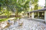 Stone patio surrounded by trees