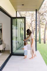 Mother and son with bi-fold door. 