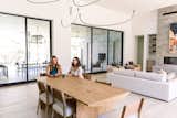 Two women sit and chat in beautiful, transitional home in West Lake Hills, Austin. 