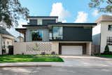 RAM picture and casement windows cover the facade of this modern artistic home by Brad Hollenbeck.