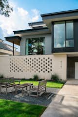 RAM picture and casement windows cover the facade of this modern artistic home by Brad Hollenbeck.