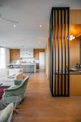 Modern kitchen and sitting room are illuminated by RAM picture windows.