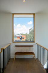 RAM picture window with aluminum frames and wooden accents show off a gorgeous view of Houston.