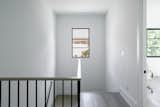 RAM picture window illuminates staircase in modern Dallas area home.