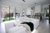RAM expansive picture window and sliding door illuminates this master living area with natural light.