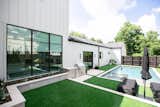 RAM aluminum framed picture window and sliding door create a welcoming outdoor space at this modern Dallas area home.