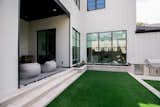 RAM aluminum framed picture window creates a welcoming outdoor space at this modern Dallas area home.